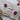 Earrings feature one pink coin pearl and one white coin pearl, dangling gracefully from sterling silver earring hooks.