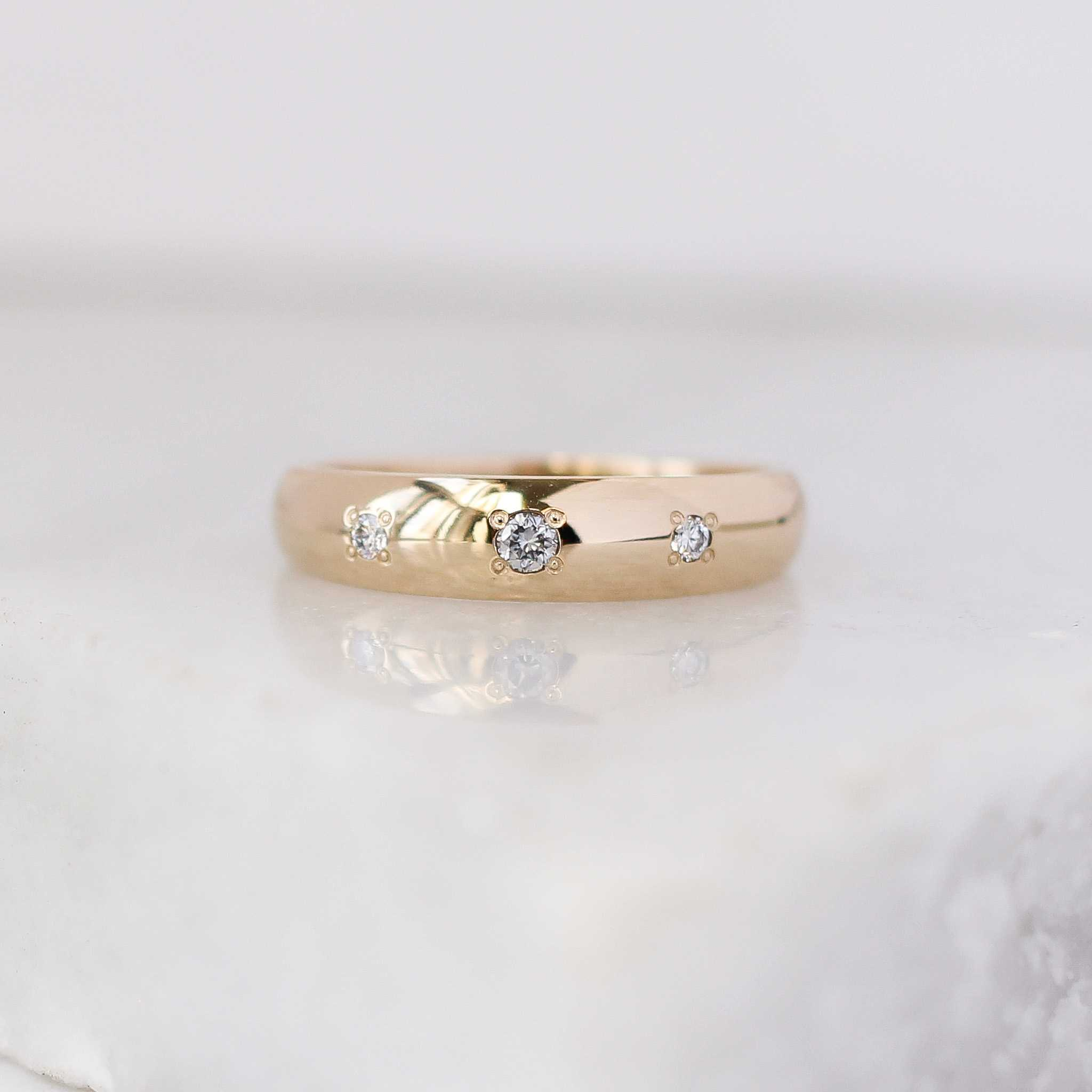 14k yellow gold Domed Diamond Band with 3 embeded  0.06ct of round brilliant cut Canadian diamonds