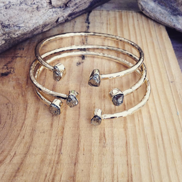 Open hammered brass cuff with double accent stones
